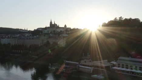 Sunset-rays-over-Prague-city-centre-and-Vltava-river,Czechia,cloudless