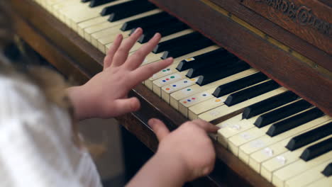A-young-girl-is-learning-to-play-the-piano