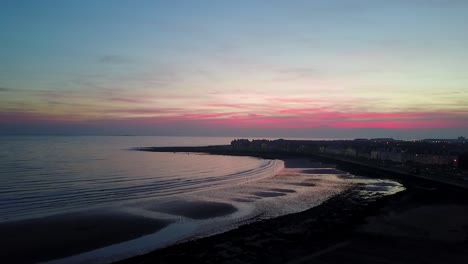 Silhouetted-Red-Skye-Beach-|-Drone-Shot
