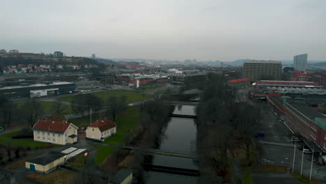 Rising-up-above-river-in-Gothenburg-city-on-moody-overcast-day