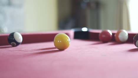 Snooker-ball-rolling-around-snooker-table