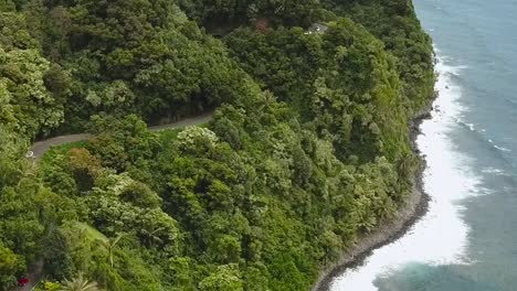 Drone-aerial-Road-To-Hana-car-driving-beach-side-Hawaii