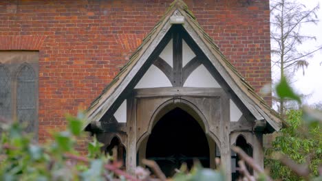 Close-up-of-Tudor-style-doorway-entrance-on-brick-building