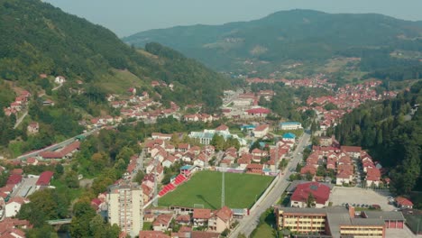 Aerial-truck-shot-over-the-valley-town-of-Ivanjica-in-Serbia-on-a-bright-day