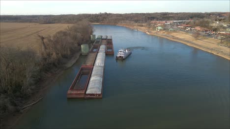4K-aerial-footage-of-a-barge-docked-on-the-side-of-the-Cumberland-River-in-Clarksville-Tennessee