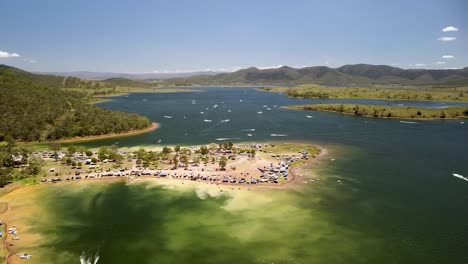 Aerial-Parallax-View-Of-Busy-Coastline-At-Lake-Somerset-In-Queensland