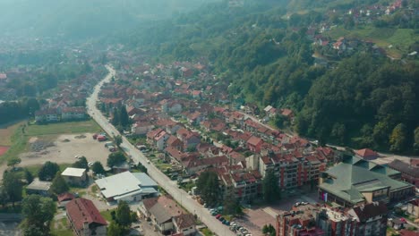 Aerial-View,-Ivanjica,-Serbia,-Small-Picturesque-City-in-Sunny-Valley-on-Summer-Day,-Drone-Shot