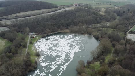 Drone-aerial-footage-of-a-4k-drone-flying-very-close-over-a-frozen-lake-in-Germany