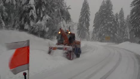 Snow-blower-clear-snowy-road-at-Black-Forest,-Germany