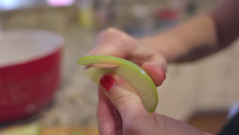 Closeup-of-an-apple-slice-being-peeled-in-slow-motion