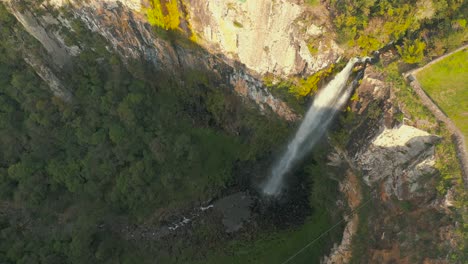 Aerial-top-down-view-of-big-rock-wall-rainforest-waterfall-in-located-in-Urubici,-Santa-Catarina,-Brazil