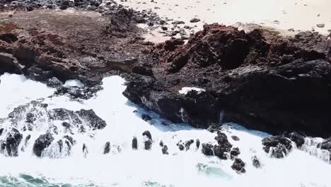 Drone-aerial-parallax-waves-crashing-against-rocks