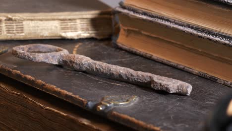 Rusty-key-and-old-books-evocating-religious-concept-about-life