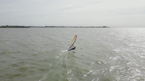 Drone-shot-of-a-windsurfer-at-full-speed-at-a-windy-day-in-Holland