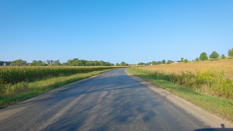 POV-driving-on-rural-county-road-with-no-center-line