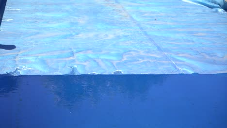 Taking-Pool-Cover-Off-Blue-Water
