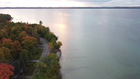 Tarcking-drone-shot-of-Lake-Michigan-coastal-shoreline-during-autumn