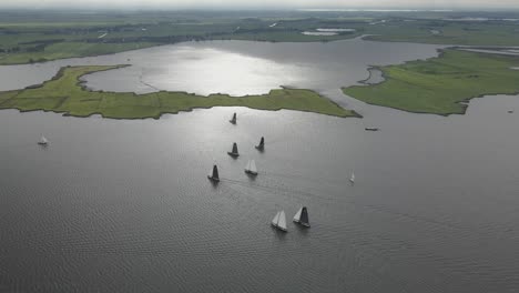 a-big-group-of-Giant-frisian-dutch-sailboat-are-sailing-on-the-sneekermeer-on-a-sunny-day