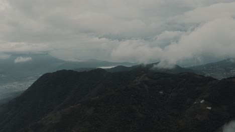 Drone-aerial-view-cloudy-rainforest-and-mountains-in-Guatemala