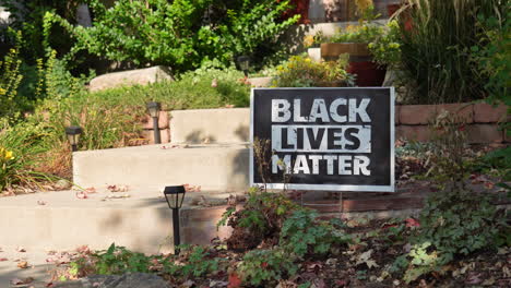 Black-Lives-Matter-Yard-Sign-Next-to-Front-Steps-of-House