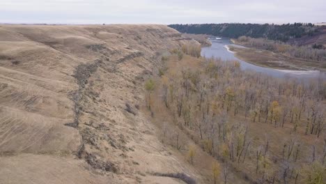 Dry-autumn-aerial-down-lower-Bow-River-Valley-with-eroded-hillside