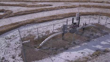 Rotating-view-of-natural-gas-pipeline-monitor-station-in-prairie-field
