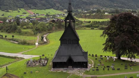 Black-Wooden-Hopperstad-Stave-Church-in-Village-of-Vikoyri,-Norway