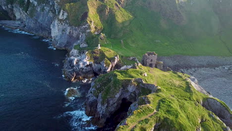 Epic-revealing-drone-shot-of-Kinbane-Castle-in-County-Antrim,-Northern-Ireland