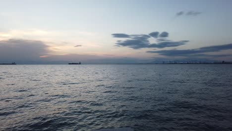 Clip-of-the-sea-and-cargo-ships-on-the-port-of-Thessaloniki-in-Greece-during-sunset