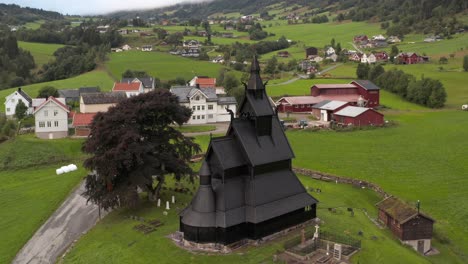 Black-Stave-Church-in-a-Countryside-Village-of-Norway