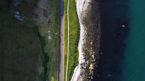 Downward-aerial-view-of-road-on-coastline-in-northern-Ireland