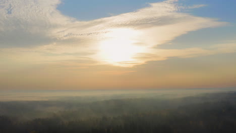Drone-shot-of-vast-misty-wilderness-by-dawn