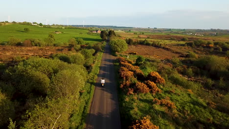 Drone-shot-tracking-two-people-on-a-motorcycle-in-Ballymoney