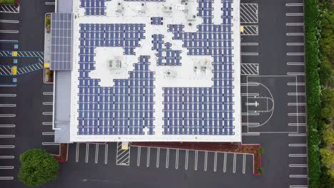 Photovoltaic-solar-panel-modules-mounted-on-flat-roof-absorbing-sunlight-as-a-source-of-energy-and-generate-electricity-creating-sustainable-energy
