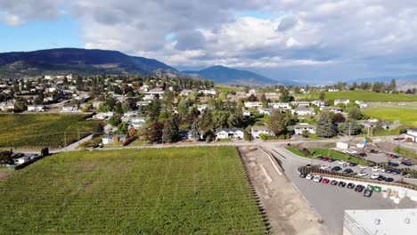right-drone-aerial-sweep-over-winery-and-vineyards-towards-mainland