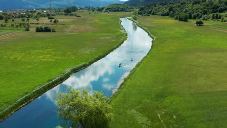Croatia-in-Summer,-Aerial-view-of-Kayaks-on-Gacka-River-in-Countryside