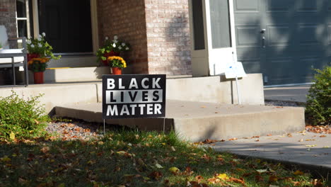 Black-Lives-Matter-Yard-Sign-on-Front-Porch-of-House-Steps-with-Flowers