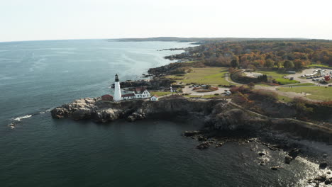Scenic-aerial-shot-of-Portland-Head-Light,-Maine,-calm-waters