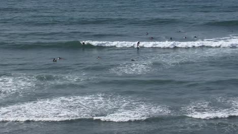 Surfers-waiting-for-good-waves-in-the-ocean