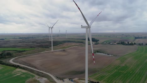 Wind-Turbines-At-The-Rural-Field-In-Kwidzyn,-Pomeranian-Voivodeship,-Poland