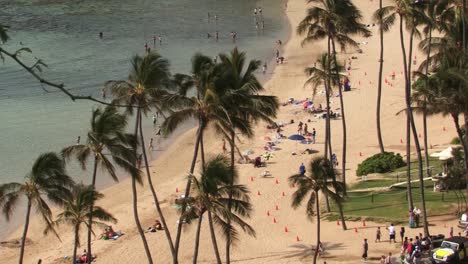 Tourists-on-the-beach-at-Hanauma-Bay,-Hawaii-Kai-neighborhood-of-East-Honolulu,-Oahu