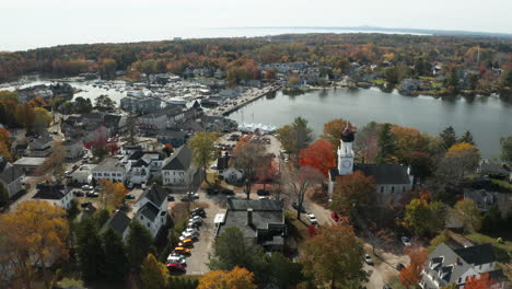 Panoramic-aerial-view-of-a-charming-coastal-town-in-autumn,-Kennebunkport-Maine