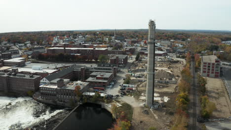 Aerial-shot-of-former-MERC-smokestack-and-area-in-Biddeford,-Maine
