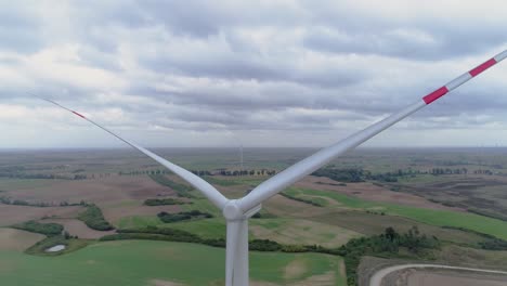 Closeup-Not-Spinning-Large-Windmill-In-A-Wind-Farm-Near-Kwidzyn,-Poland---Aerial-Drone-Shot