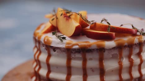 Delicious-Peach-Cake-With-Caramel-On-A-Rotating-Tray---extreme-close-up