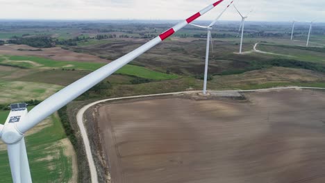 Windmills-Not-Spinning-In-The-Wind-Farm-In-Kwidzyn,-Poland---Aerial-Drone-Shot