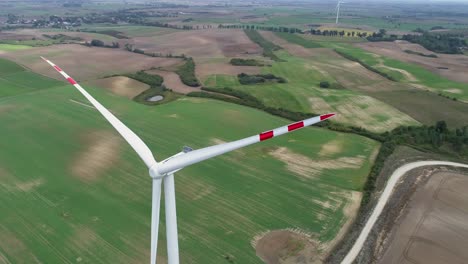 Wind-Turbine-On-The-Wind-Farm---Blades,-Nacelle,-And-Tower---aerial-orbiting-shot