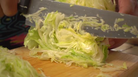 Lateral-view-of-a-lettuce-shredded-on-a-cutting-board