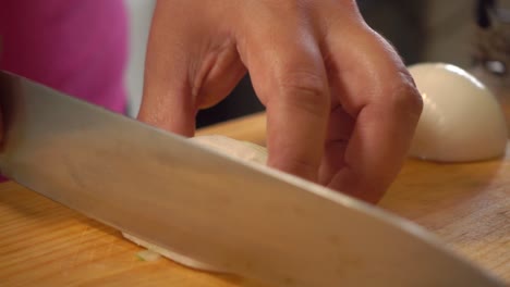 A-white-onion-sliced-and-diced-on-a-cutting-board