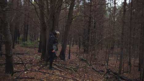 Man-Wearing-Gas-Mask-Walking-In-The-Forest---Exploring-Chernobyl-Exclusion-Zone---slow-motion